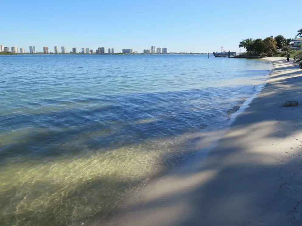 The white sand beach on the intracoastal and views of the highrises of Singer Island.