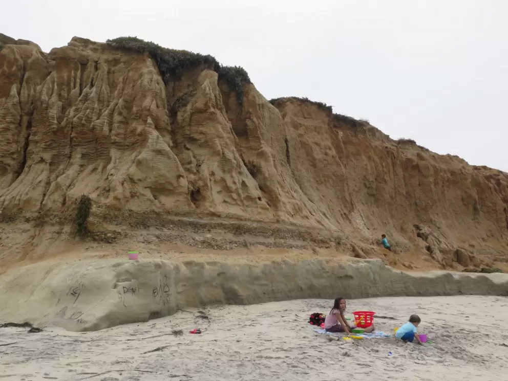 Kids playing in the sand.