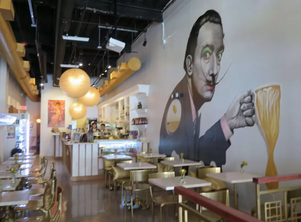 Golden chairs and mural.