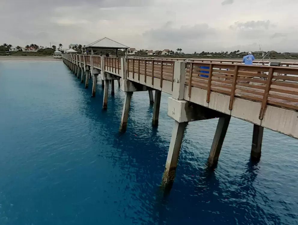 The pier, from the very end, on a stormy day when not crowded. The water was incredible! Really this color!