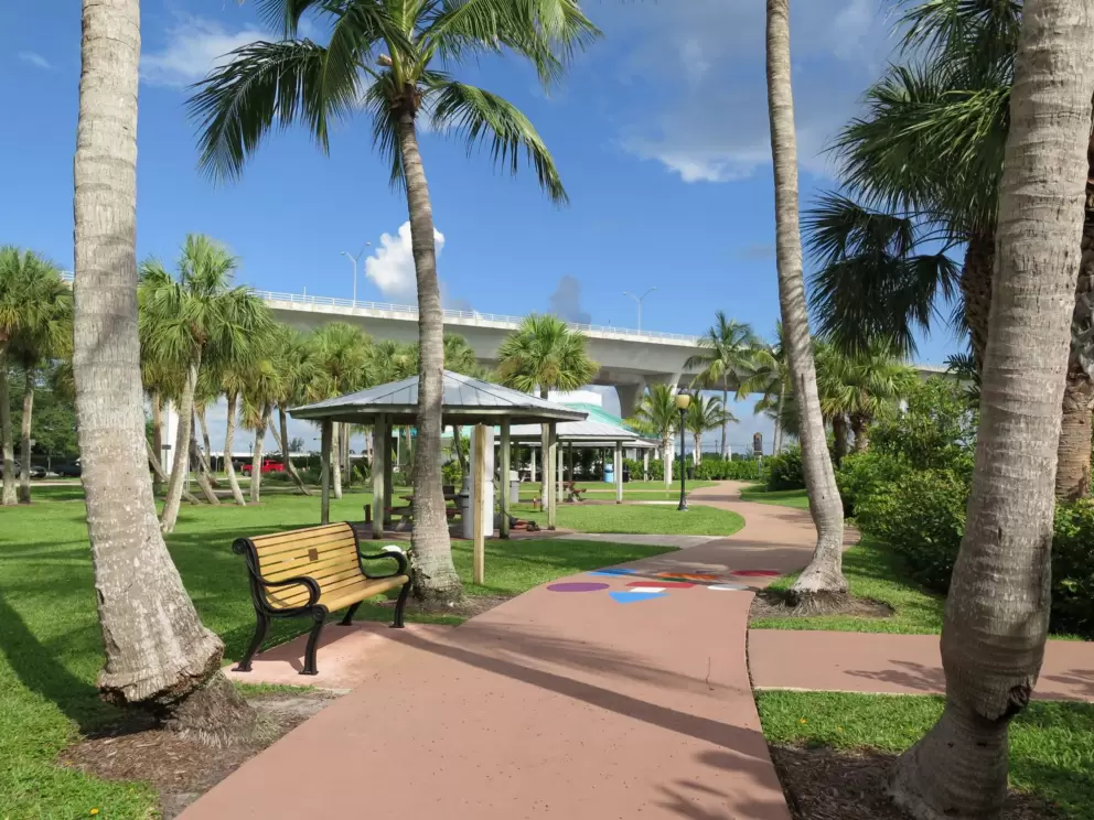 Bench, picnic pavilion and colorful pictures on the path.