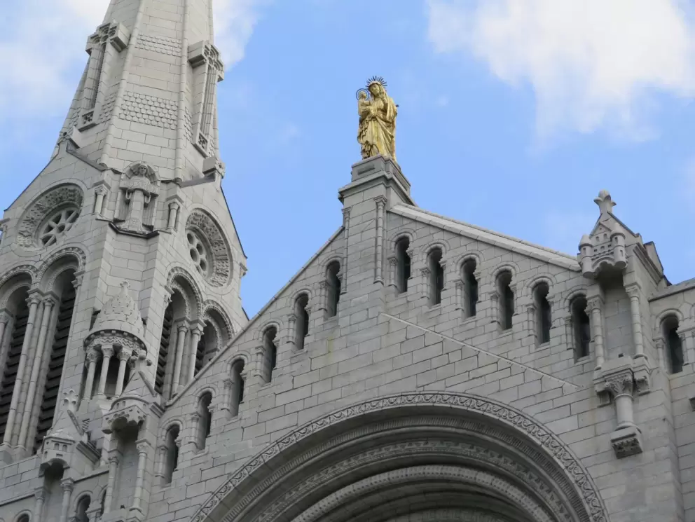 Golden statue atop the basilica. 