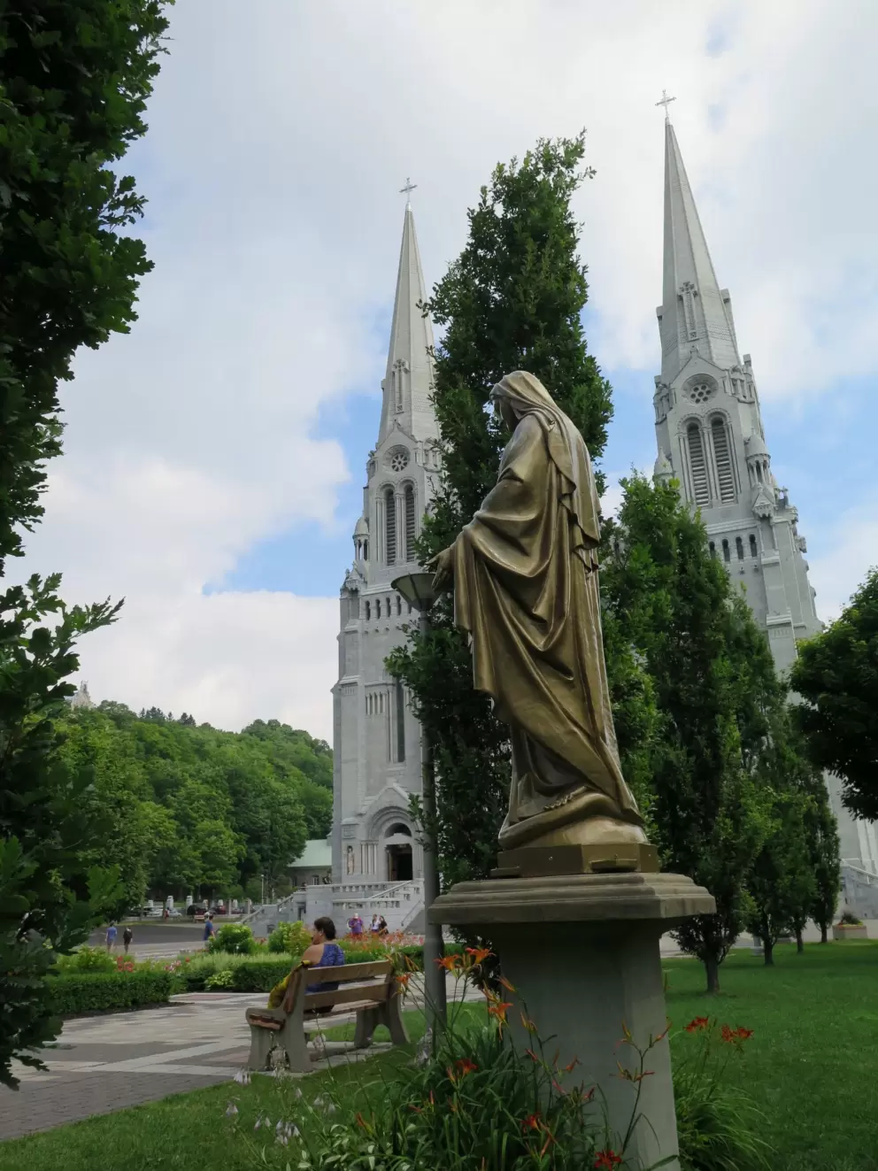 Statue of Mary, and the basilica and gardens. 