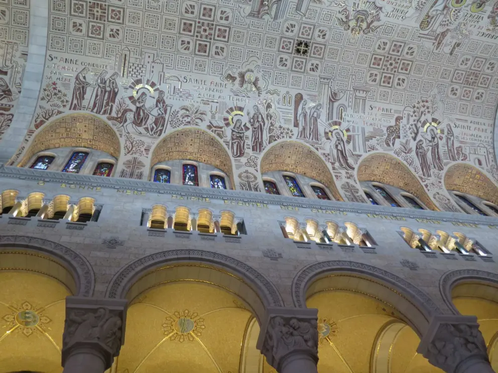Little windows letting in light, and shiny golden tiles on the ceiling mosaics.