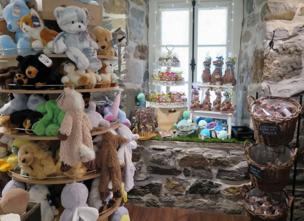 Toys and stuffies for sale at the chocolate shop.