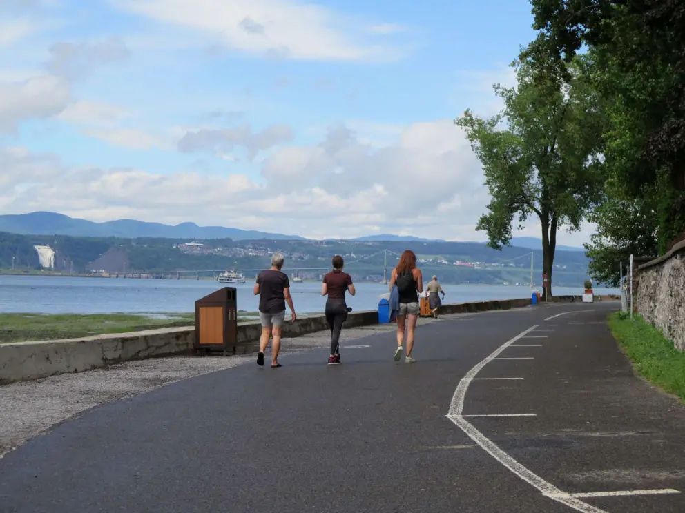 Strolling along Rue Horatio Walker, with views of Montmorency Falls across the water. 