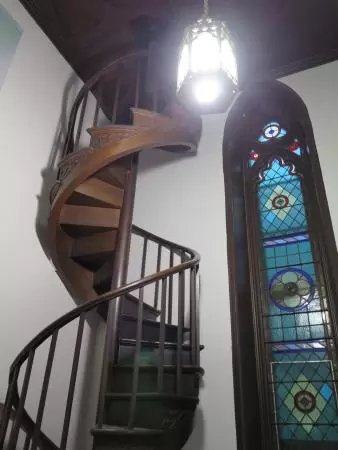 Spiral staircase and stained glass inside Bibliotheque Claire-Martin. 