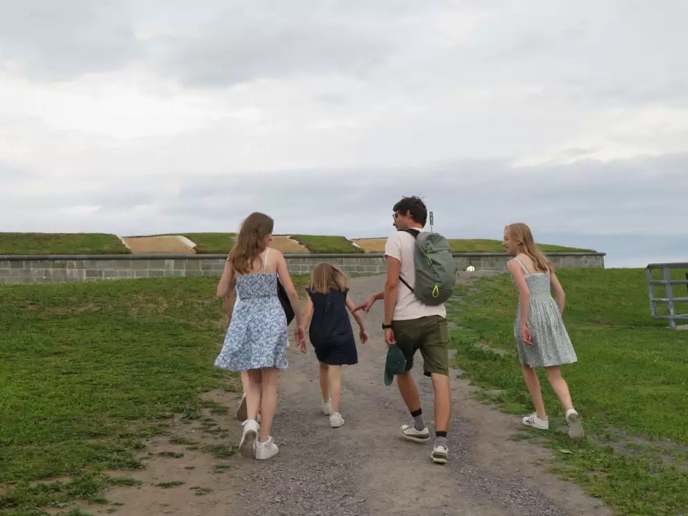 A sweet family walking on the walls. 