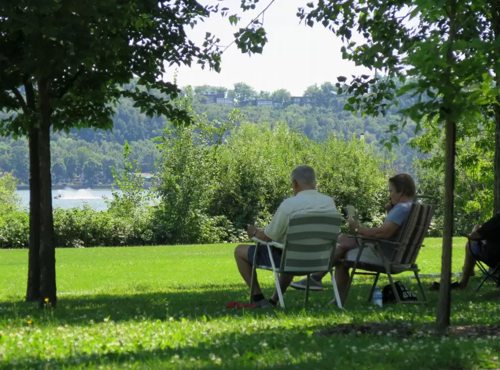 Sitting together by the river. 