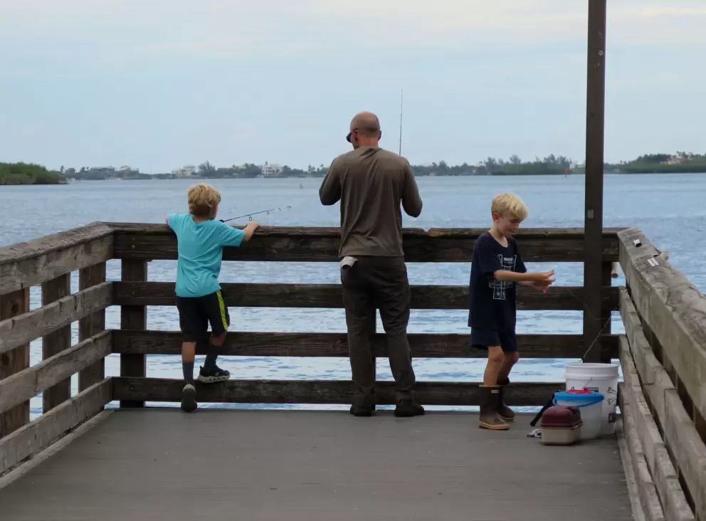 Father and sons fishing. 