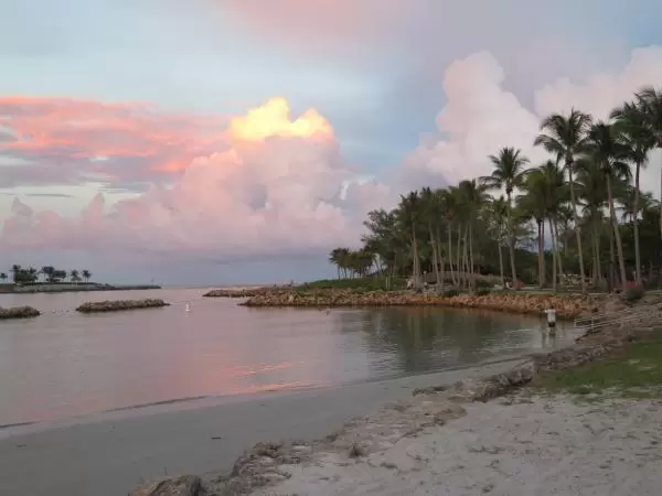 The little beach on the inlet, with pink clouds. 