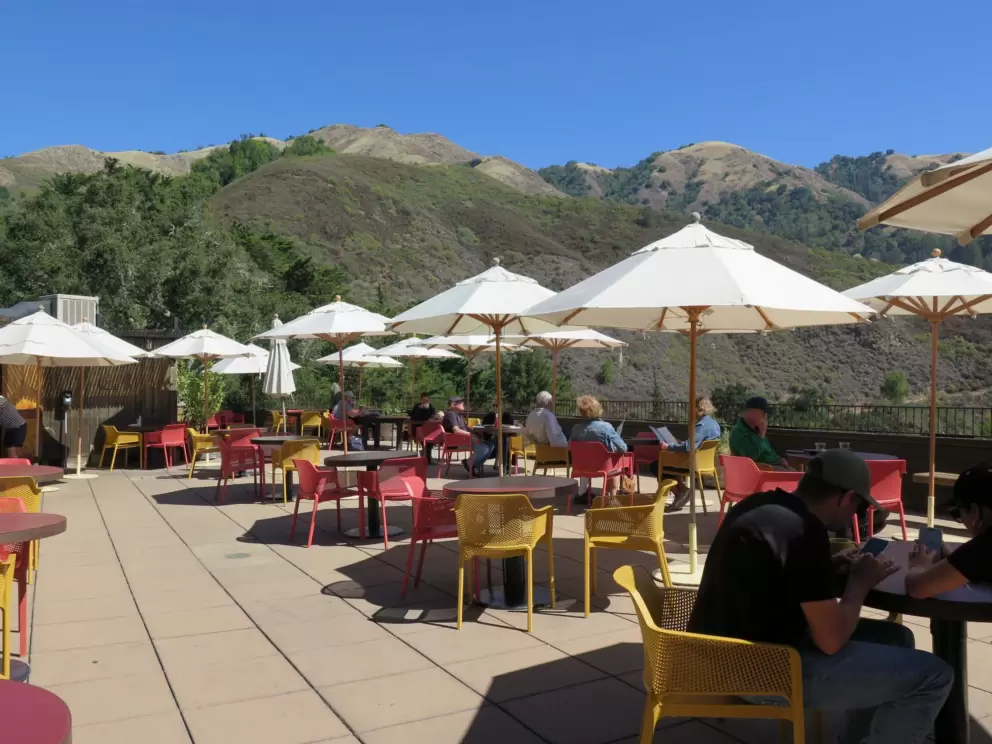 Tables with umbrellas at Nepenthe. 