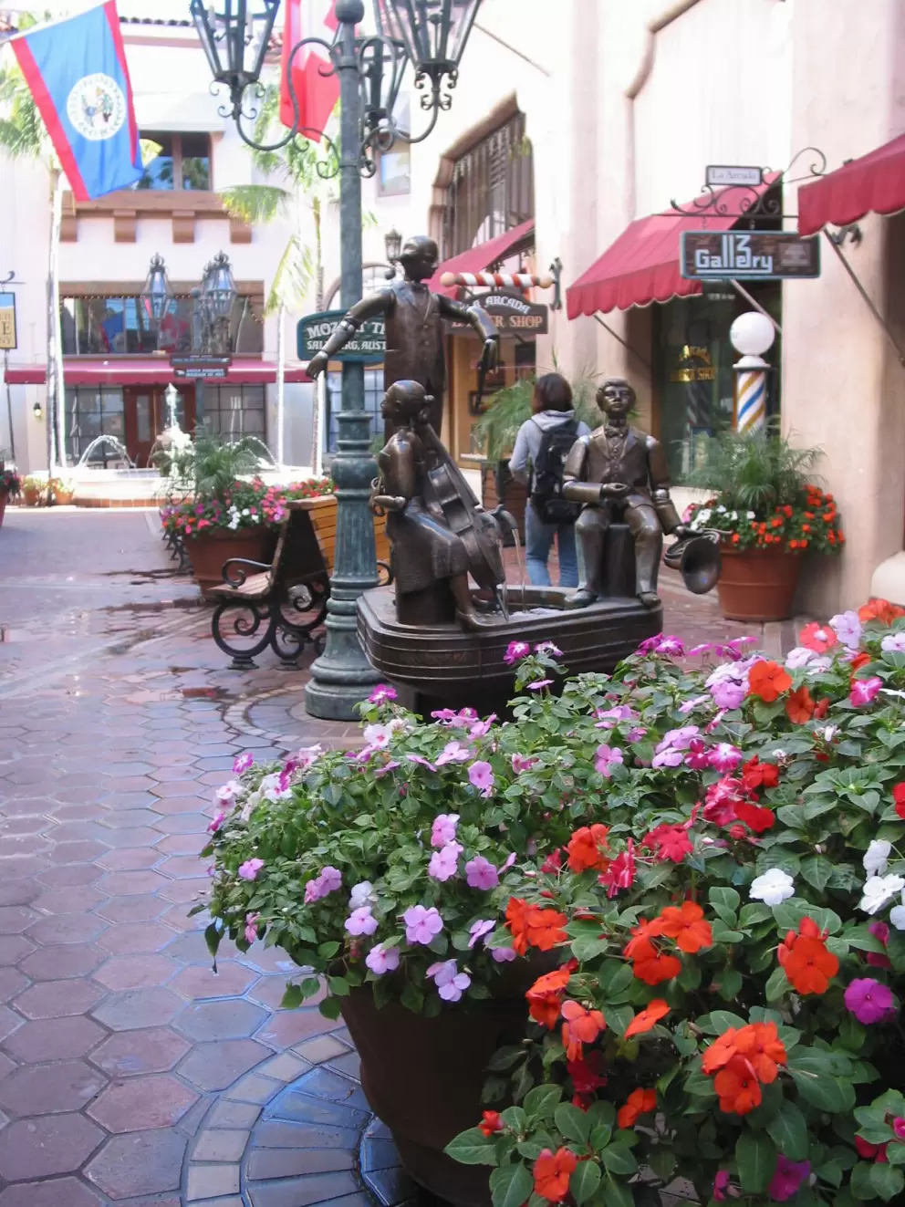 The Mozart trio statue and flowerpots.