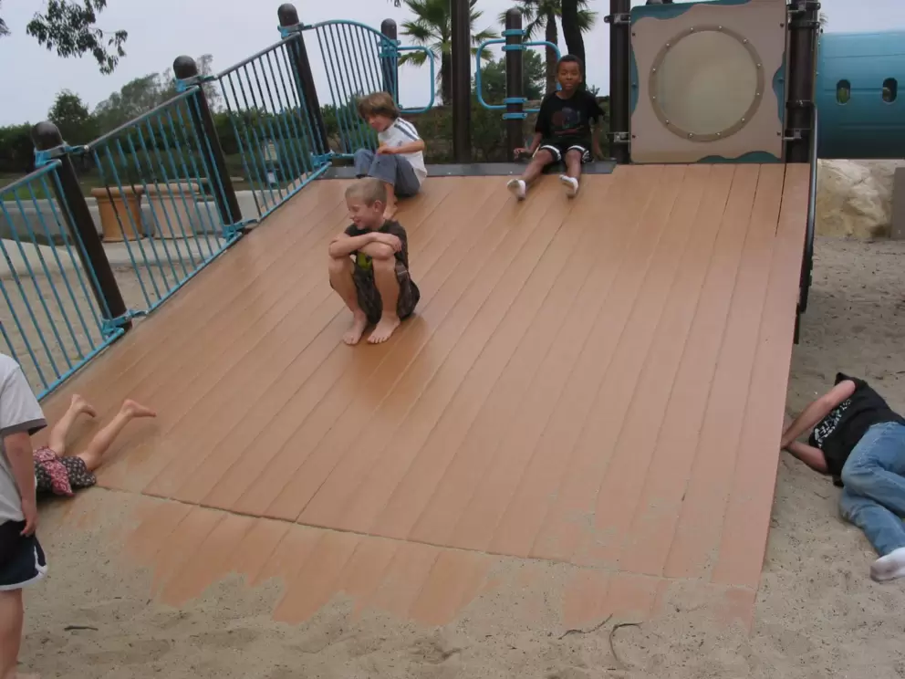 Kids having fun on the slippery slide.
