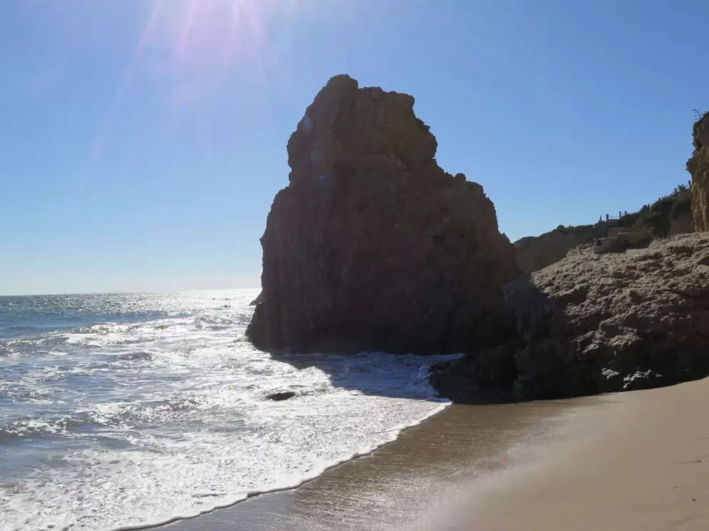 Rock and crashing waves. 