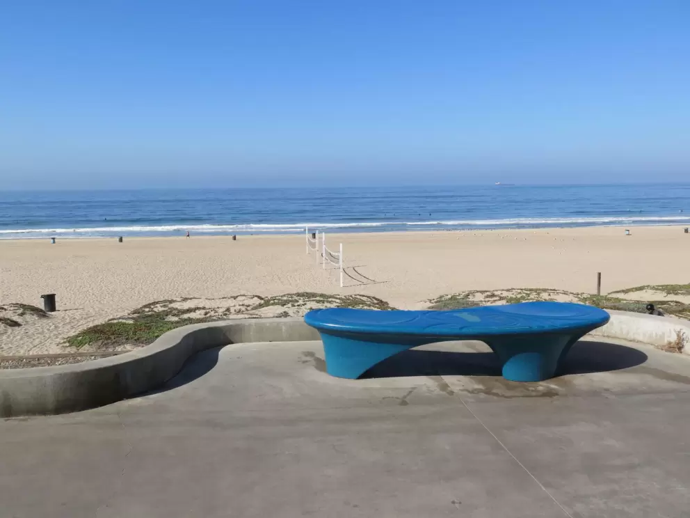 Blue bench with ocean views. 