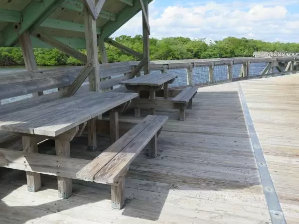 Shaded picnic benches on the boardwalk that takes you over the intracoastal. 