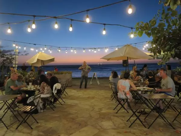 Hawaiian dancer and musician at Barefoot Beach Cafe. 