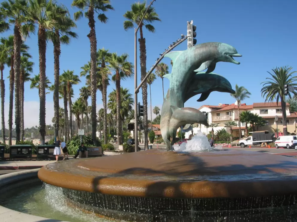 The dolphin statue at the base of the pier.