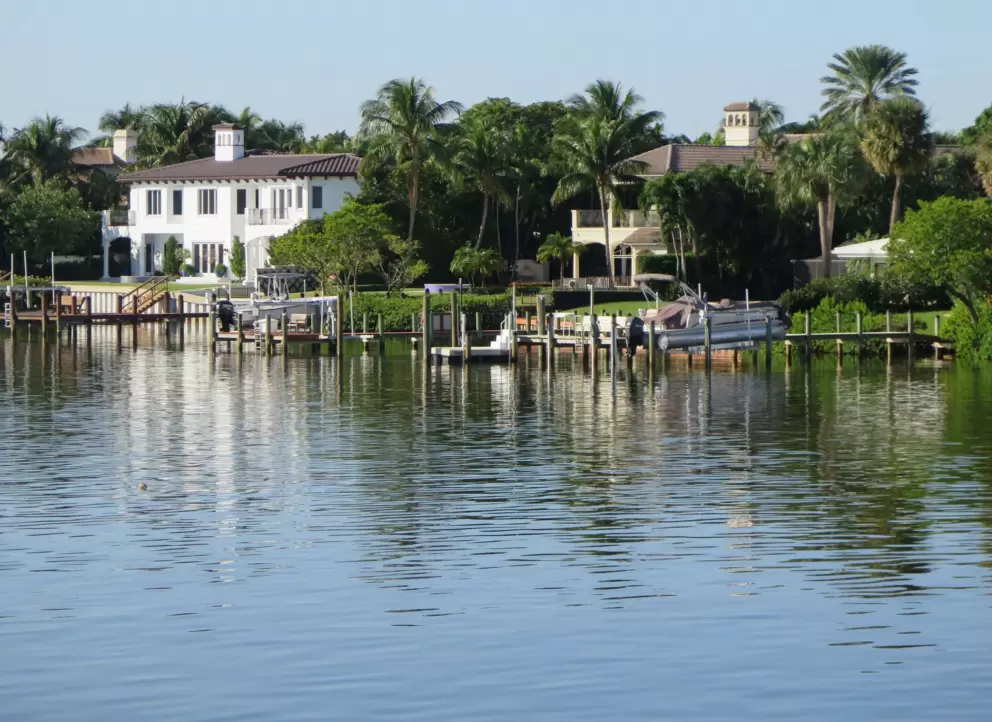 Views of mansions on the intracoastal from Tequesta Bridge. 