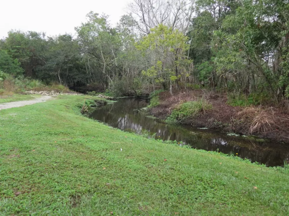 A canal by the path. 