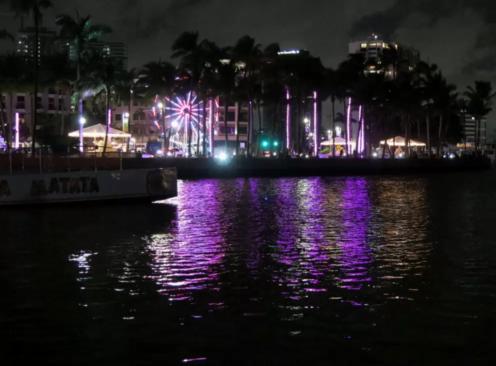 Ferris wheel and Christmas lights, reflected in the intracoastal. 