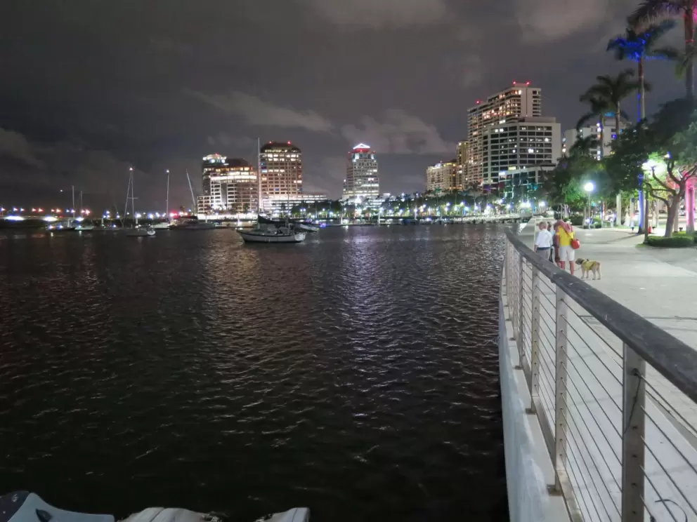 The waterfront at night, with Christmas lights. 