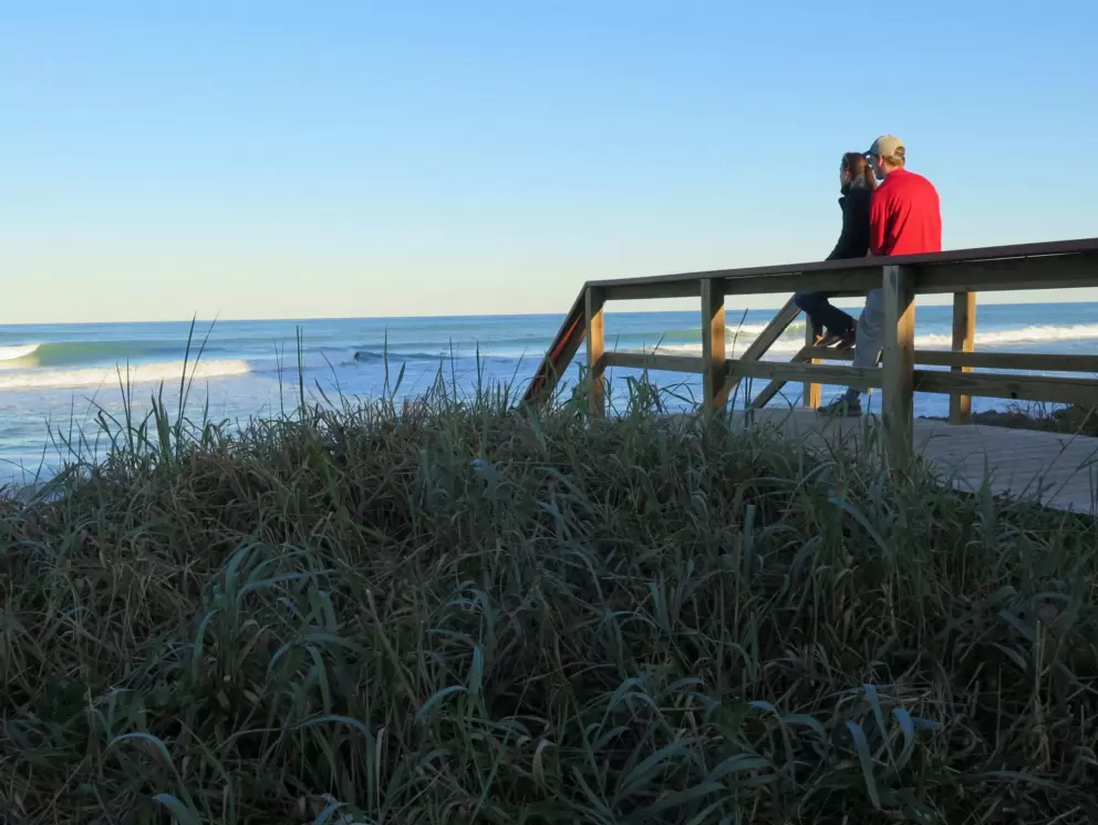 Couple watching the waves. 