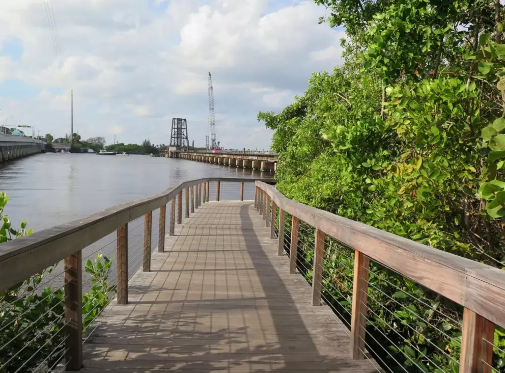 The boardwalk on the river by the park. 