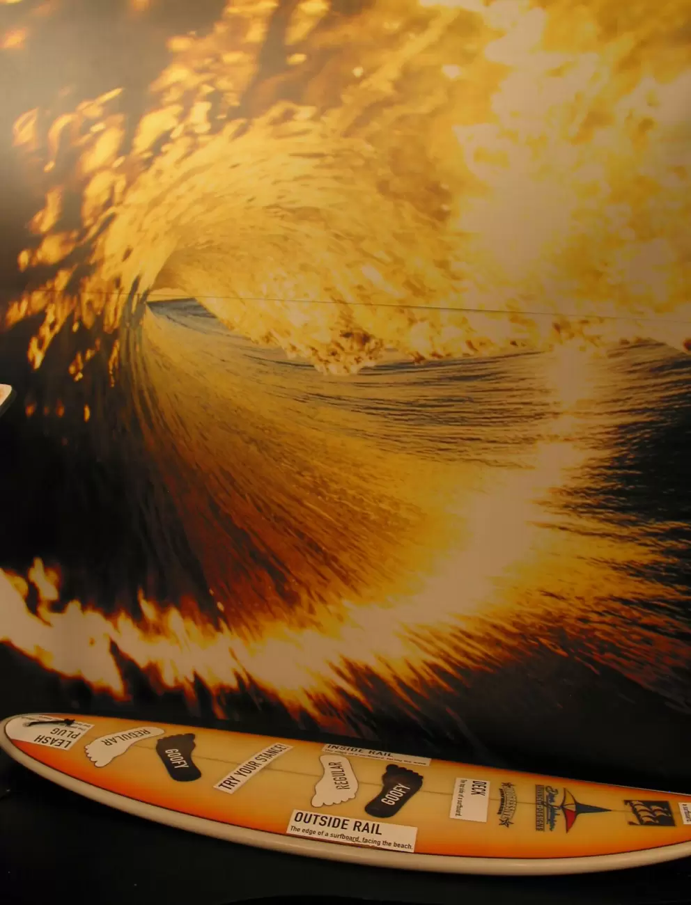 Stand on the surfboard and pose for a photo! Make sure you run your fingers along the tube like a real Pipeline surfer!