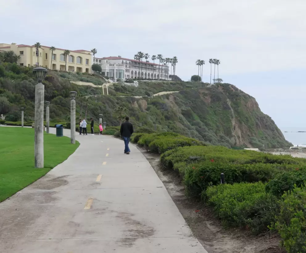 Walking along the path with the regal cliffs in the distance. 
