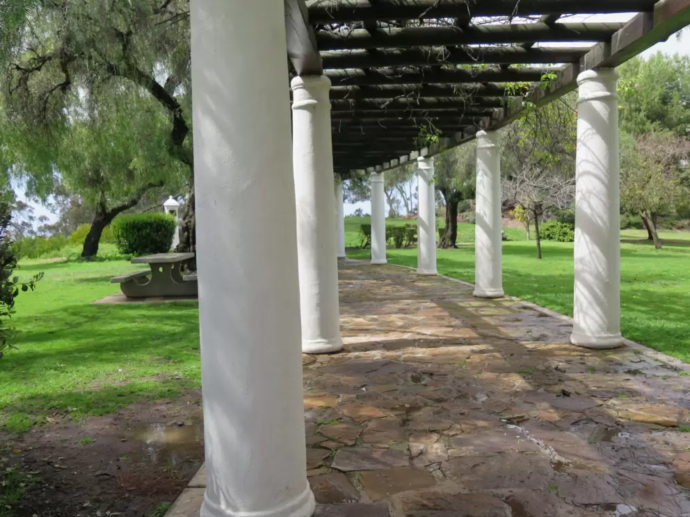The pergola curves around. 