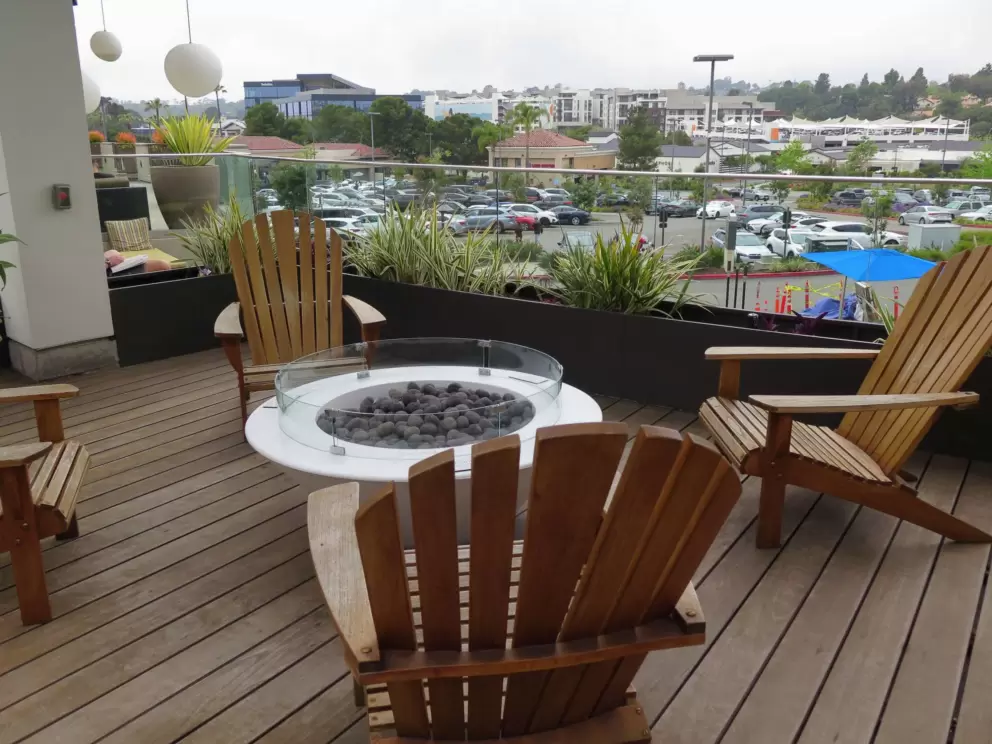 Fire pit and adirondack chairs at the public space. 