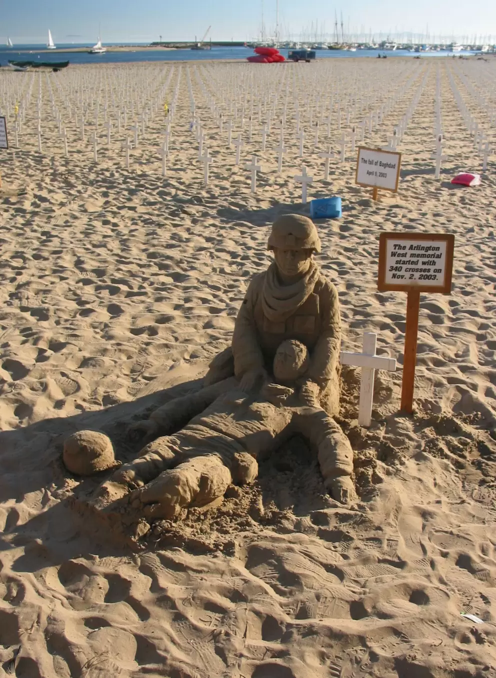 Sand sculpture of two soldiers, at Arlington West memorial. A man carves this anew every weekend.