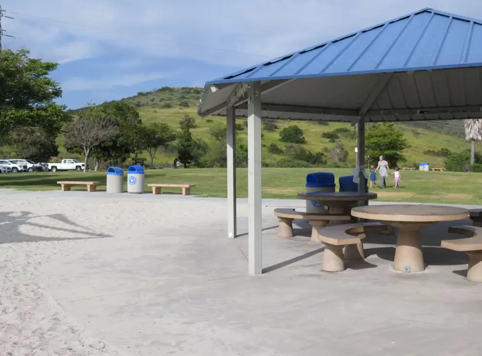 Picnic pavilion with a blue metal roof. 