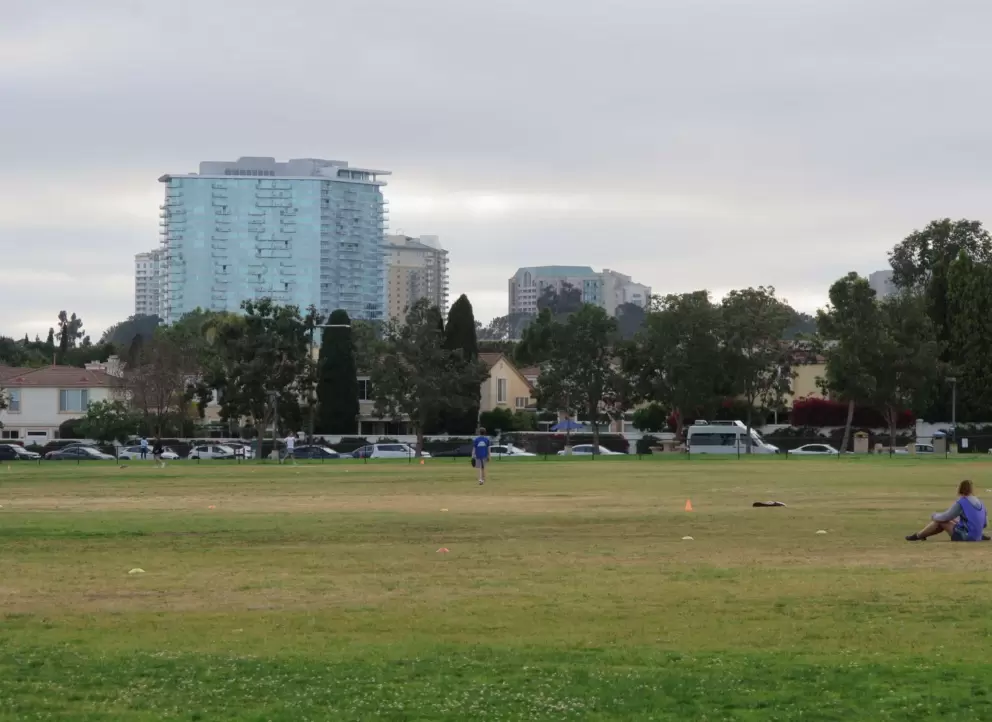 Blue-green glass building in the distance. 