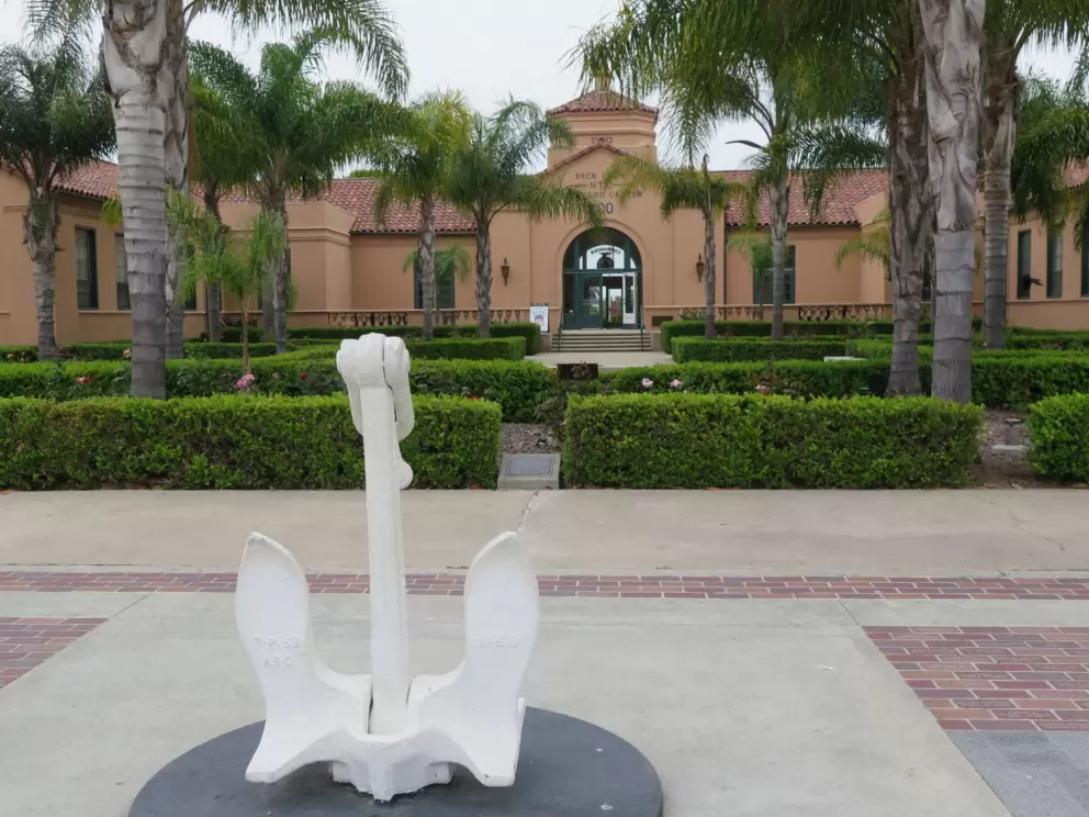 White anchor on display outside at Naval Training Command Center. 