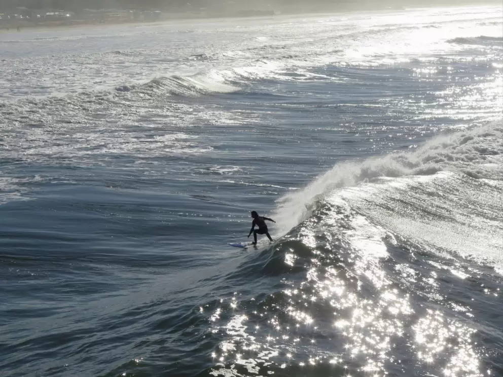 Riding a wave during the SLO Cal Surf Contest. 