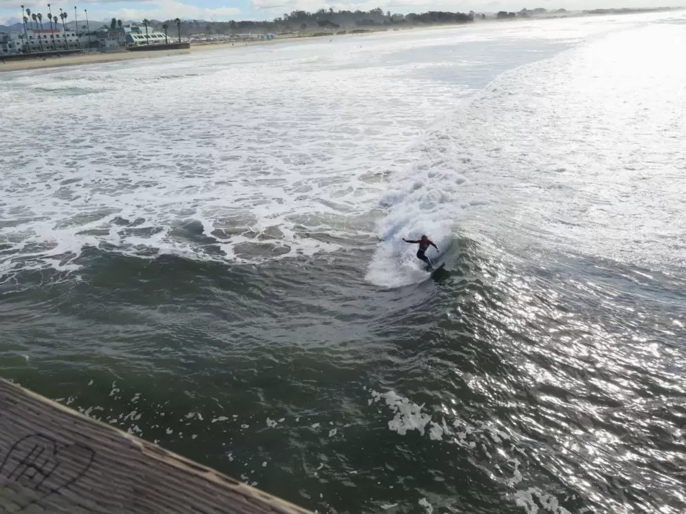 A female surfer showing off some moves during the SLO Cal Surf Contest. 