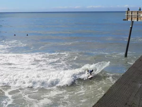 It's amazing how close the surfers come to the pier. 