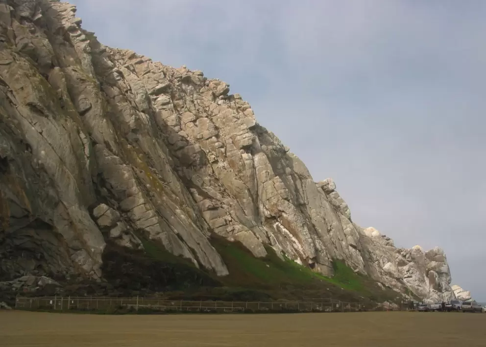 Light breaks through the thick clouds by late morning and lights up the tip of the rock.