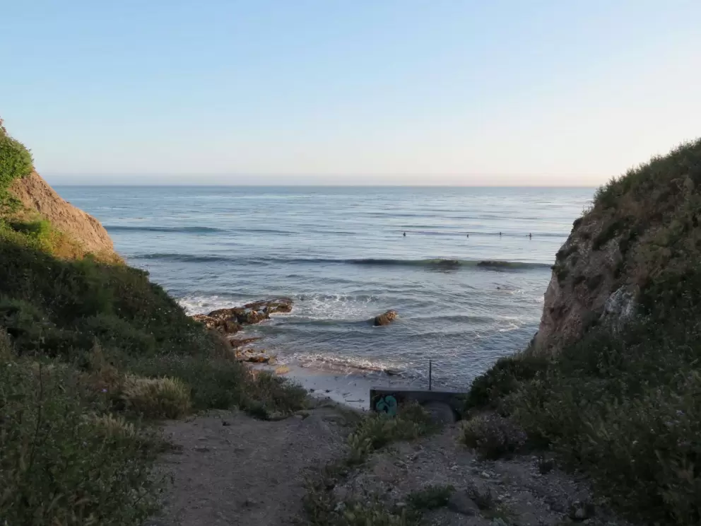 Surfers lining up for a wave. Take the dirt path to see this spot. 
