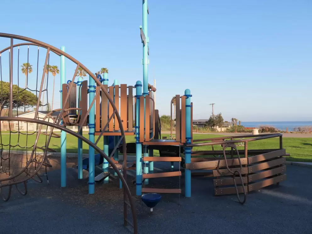 Ship play structure, with the sea beyond. 