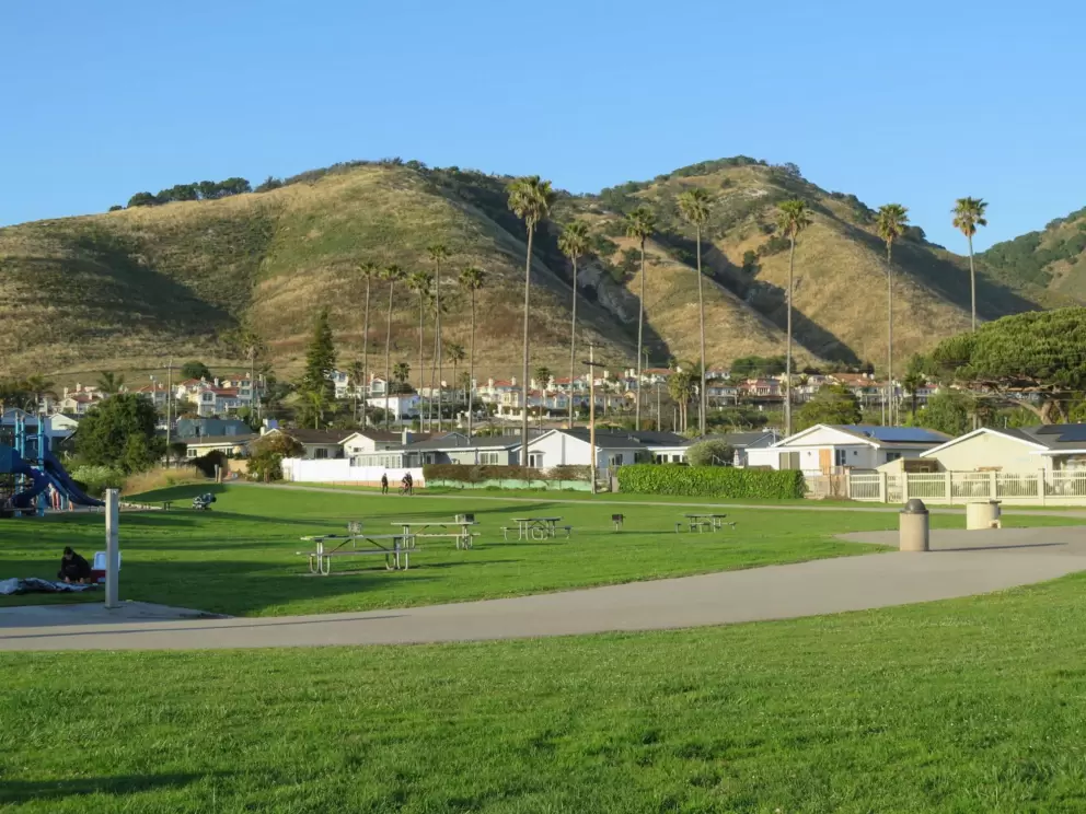 The park is lovely with a backdrop of green hills and row of palms. 