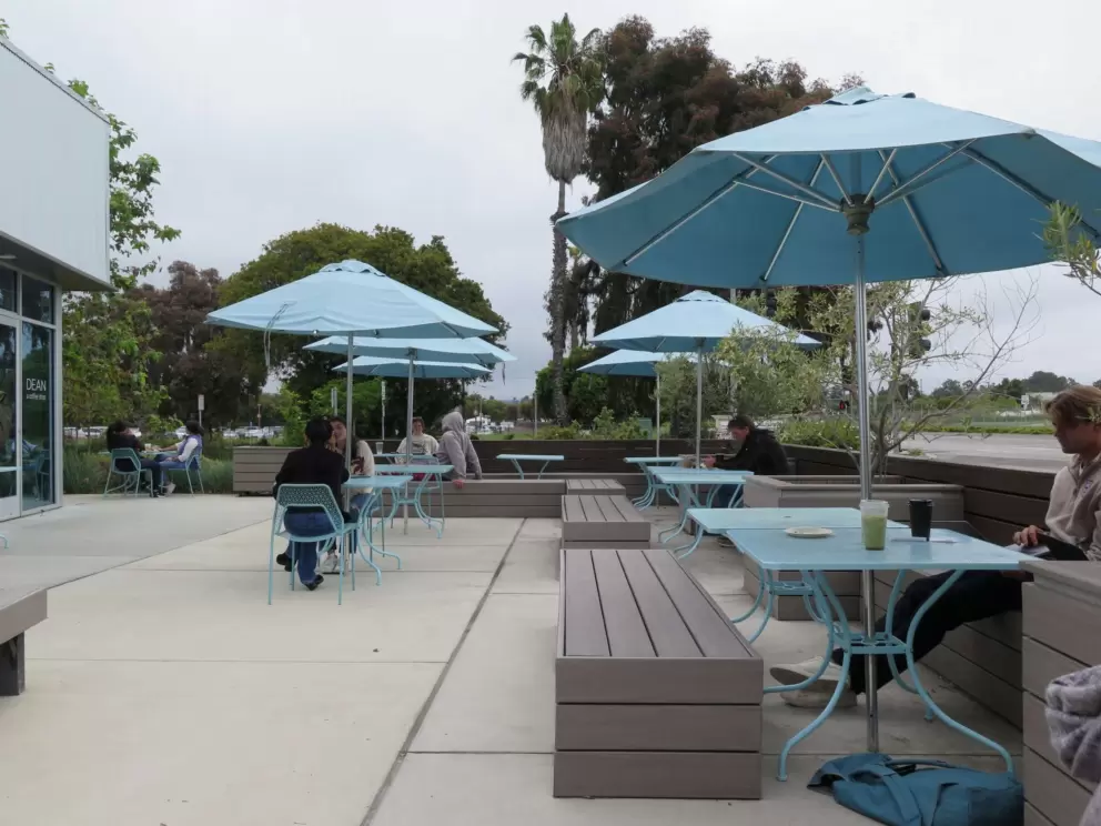 Sitting outside at Dean A Coffee Shop, six minutes drive away. 