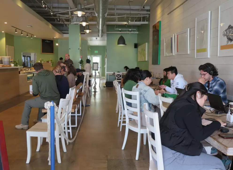 UCSD students studying inside a cafe. 