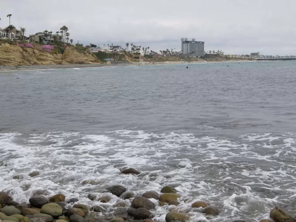 The view from the rocky beach. See the pier in the distance. 