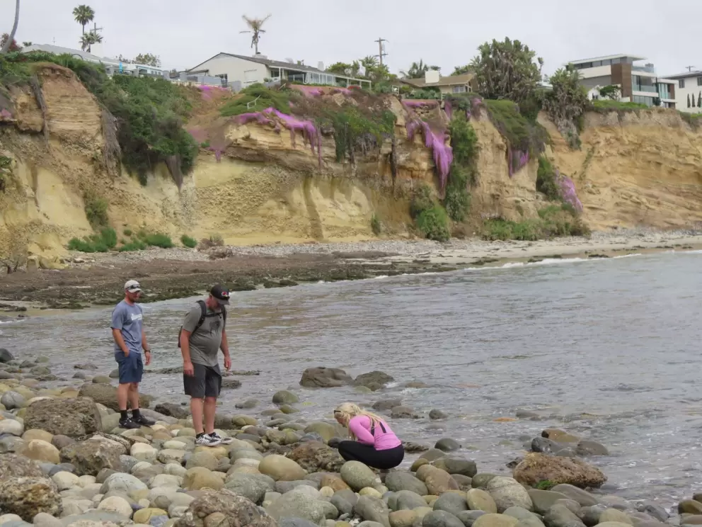 Walking on the large pebbles. 