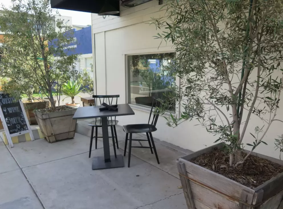Table and chairs outside a cafe. 