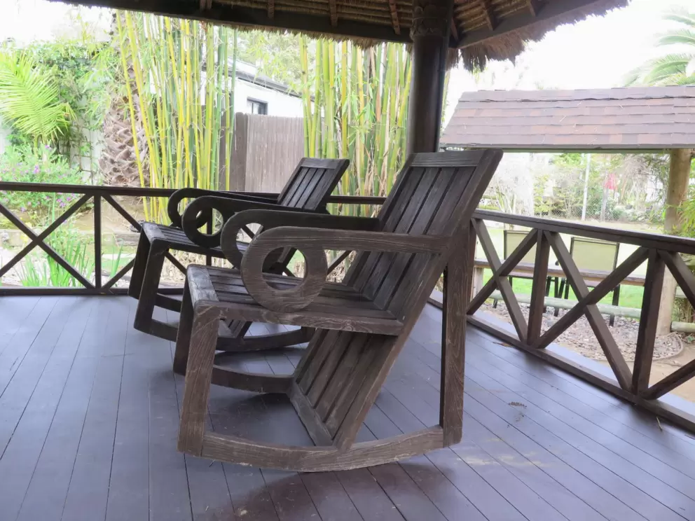Rocking chairs in a tropical gazebo at Neel's Nursery. 